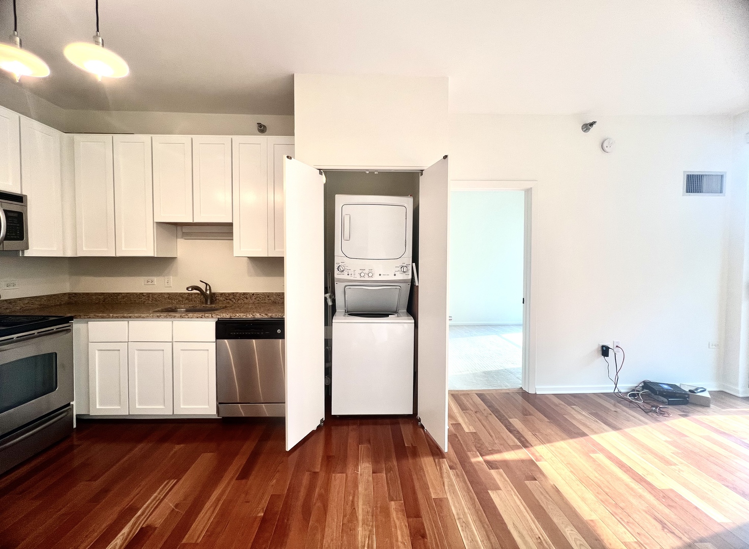 1 East 8th Street, Unit 307 Chicago, IL 60605 - Photo 8 of 23 a kitchen with a sink and a stove top oven