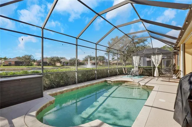 a view of a swimming pool with a patio