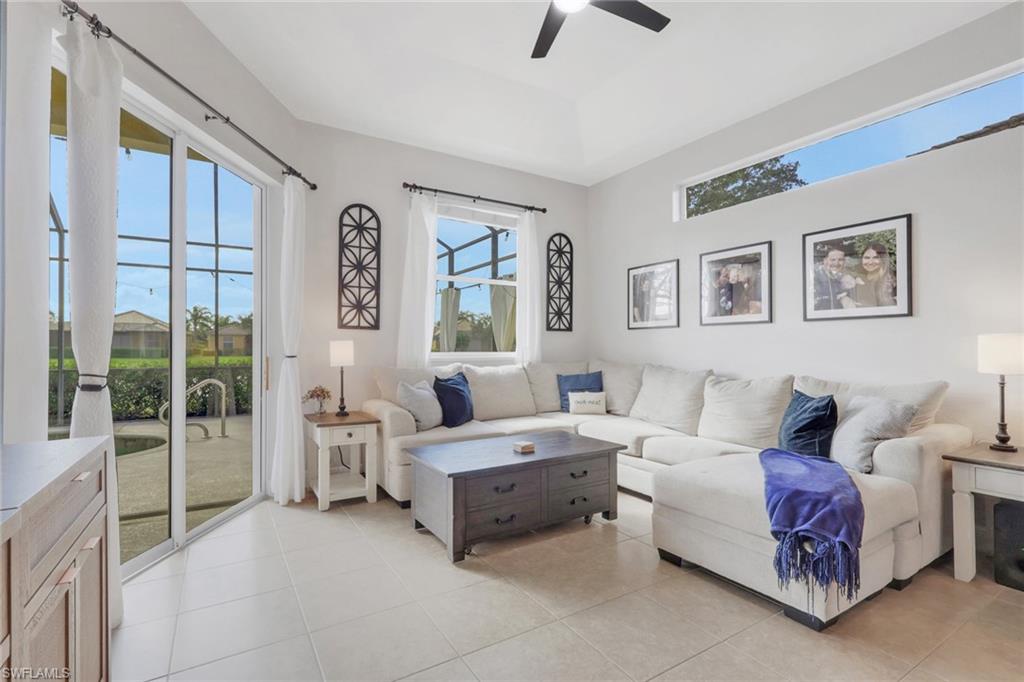15464 Cortona Way Naples, FL 34120 - Photo 12 of 47 Living room featuring light tile patterned floors and ceiling fan