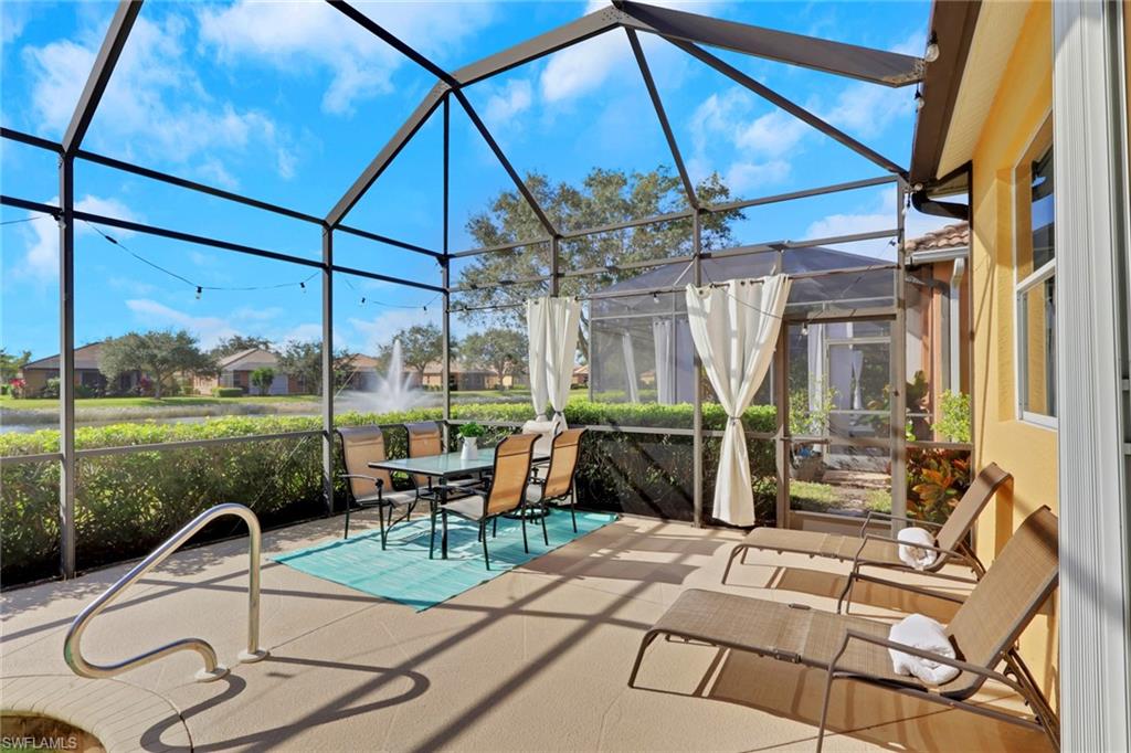 15464 Cortona Way Naples, FL 34120 - Photo 29 of 47 a view of a porch with furniture and backyard