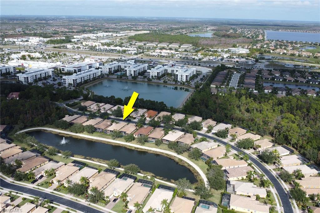15464 Cortona Way Naples, FL 34120 - Photo 32 of 47 an aerial view of a house with a lake view