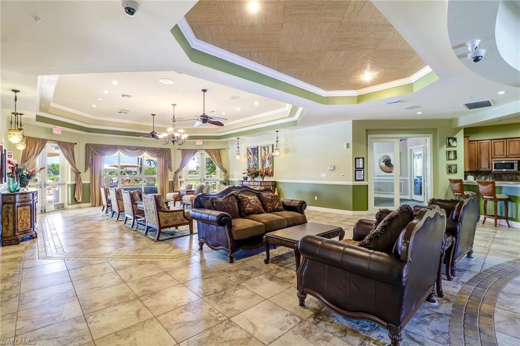 15464 Cortona Way Naples, FL 34120 - Photo 42 of 47 a living room with furniture and a large window