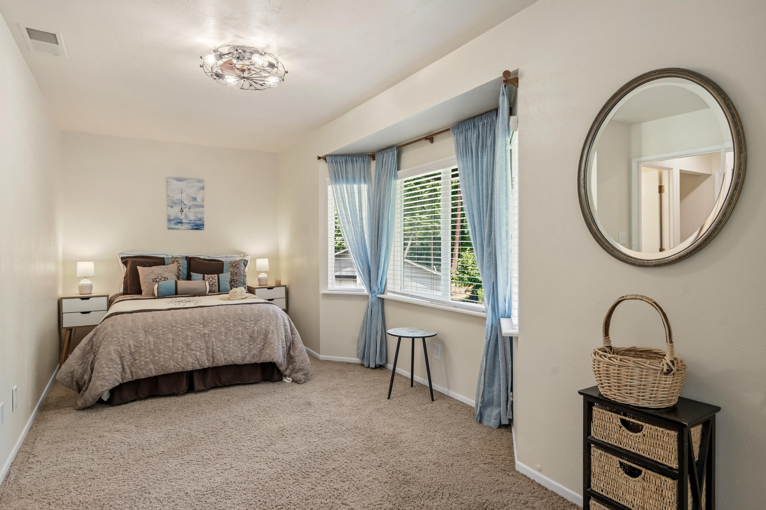 3268 Humbug Creek Road Jacksonville, OR 97530 - Photo 20 of 36 a bedroom with a bed and a mirror