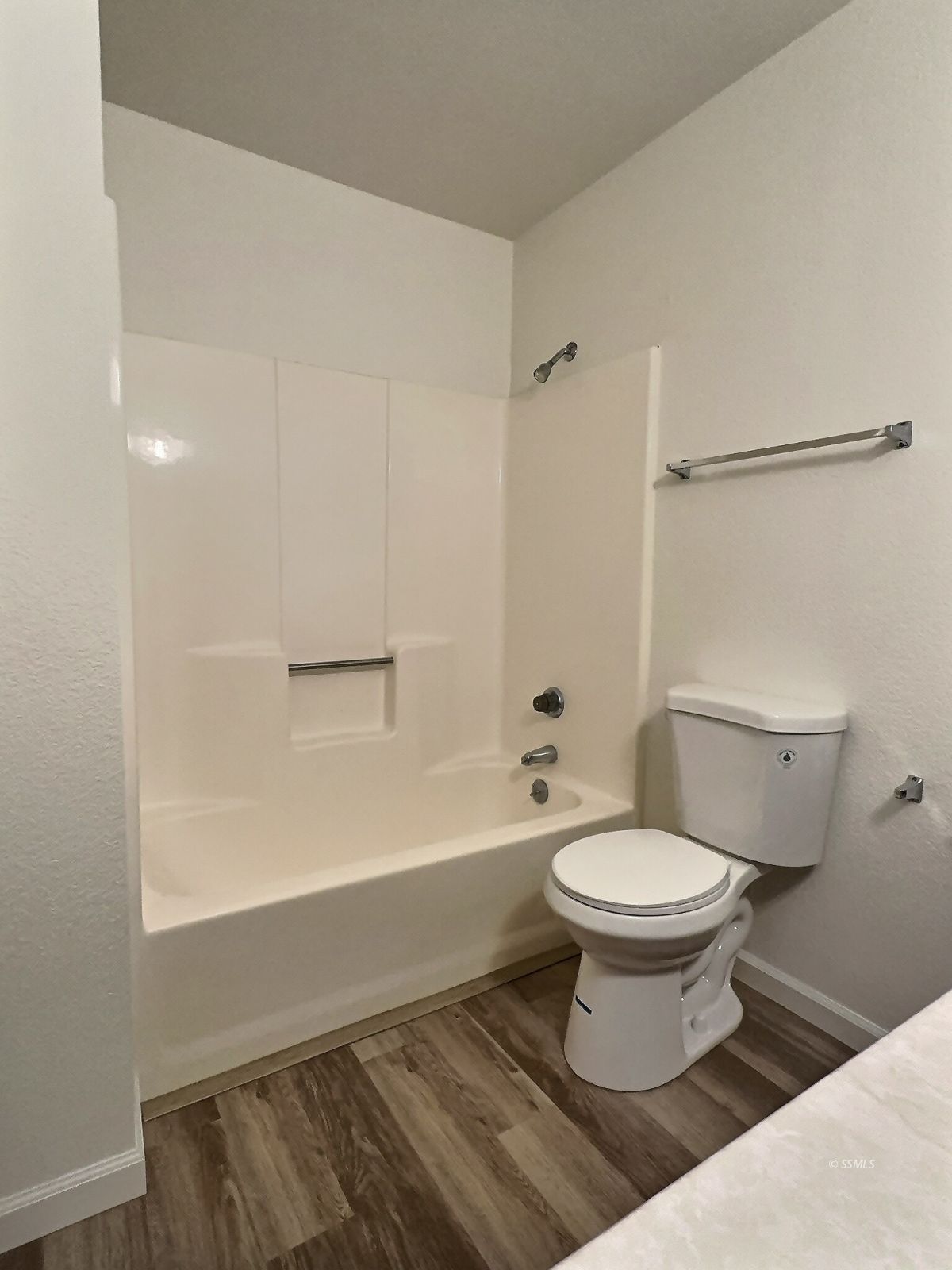 608 South Silver Ridge Street Ridgecrest, CA 93555 - Photo 20 of 30 a bathroom with a sink toilet a mirror and shower