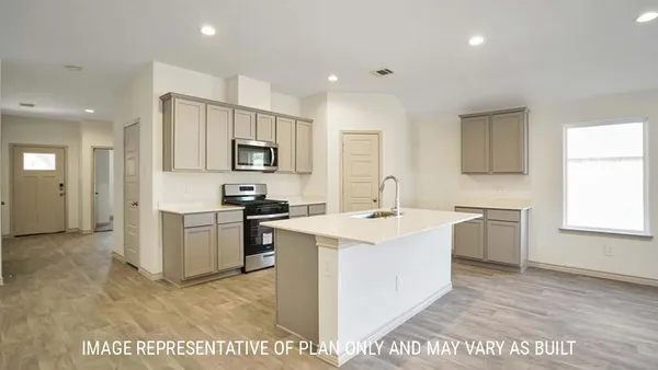 a kitchen with a sink stove and refrigerator