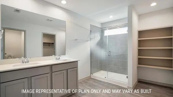 a bathroom with a shower sink and mirror