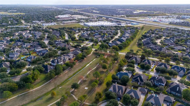 an aerial view of city and lake