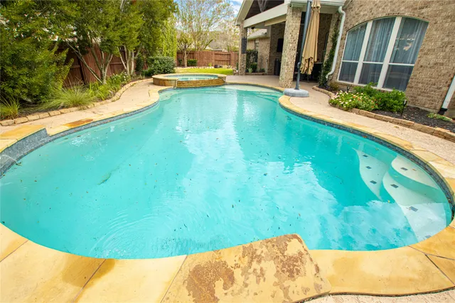 a view of a swimming pool with a sitting space