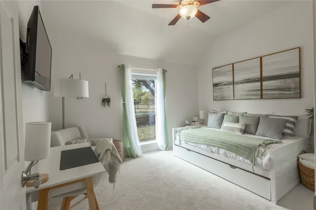 a dining room with furniture wooden floor a rug and a chandelier