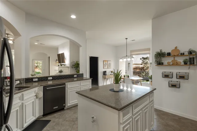a view of a dining room with furniture and window
