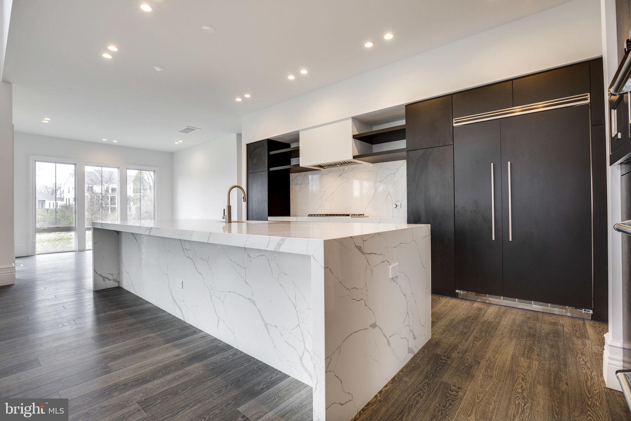 23075 Red Sunset Place Aldie, VA 20105 - Photo 28 of 89 Kitchen w/ built-in SubZero refrigerator