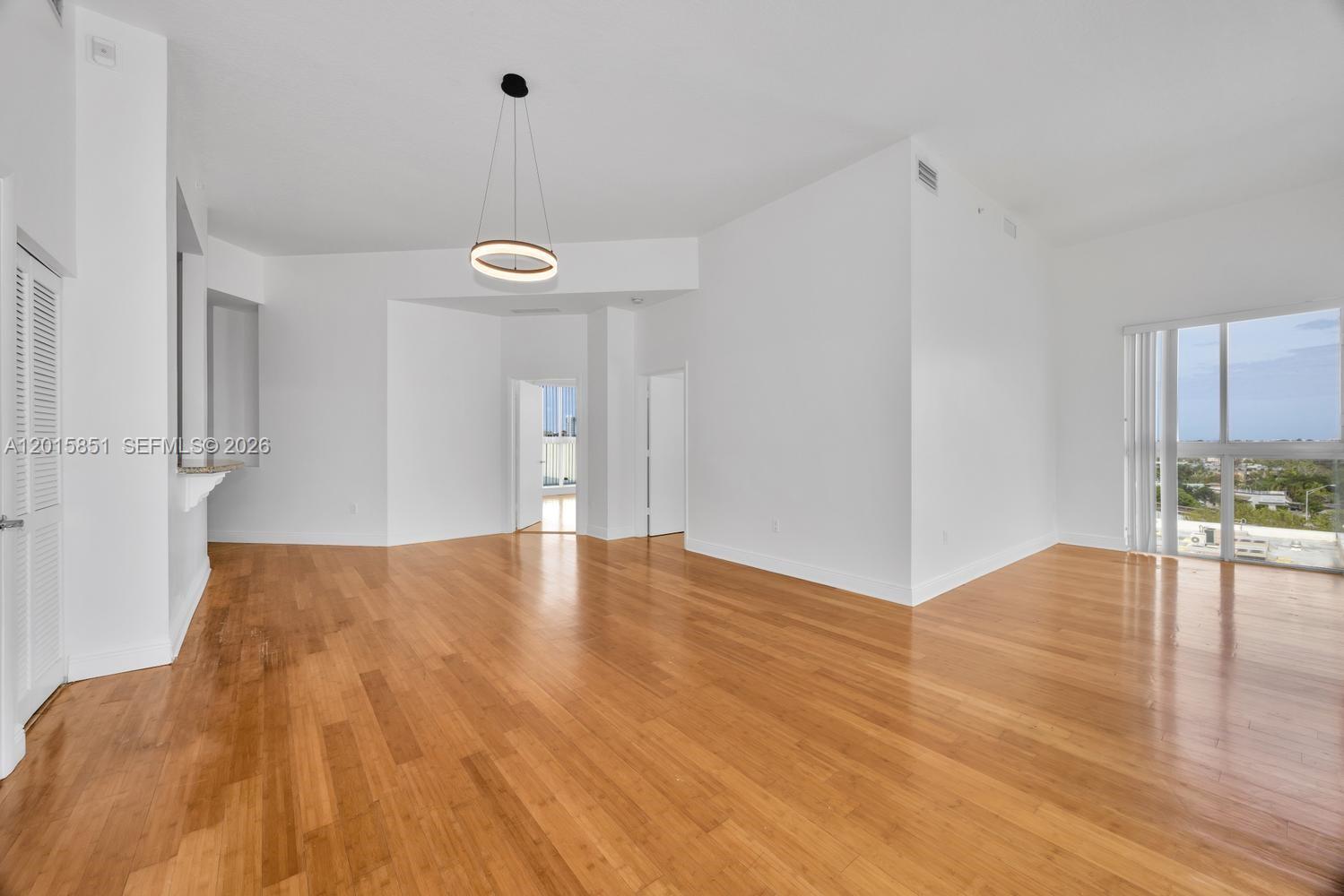 7275 Southwest 90th Street, Unit C719 Miami, FL 33156 - Photo 6 of 25 a view of a livingroom with wooden floor