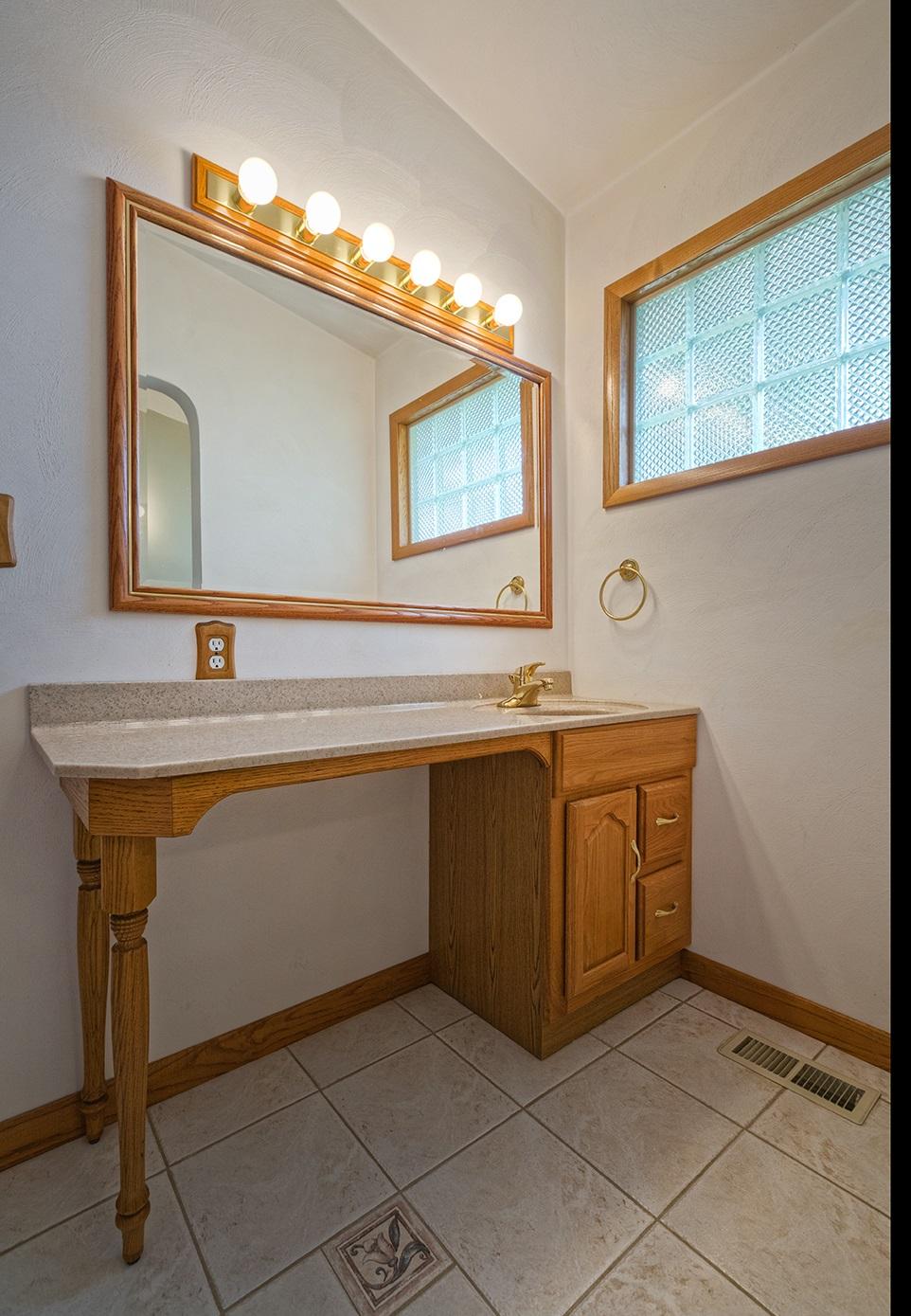 4925 Grape Tree Lane Roanoke, VA 24018 - Photo 11 of 27 a spacious bathroom with a sink and a mirror