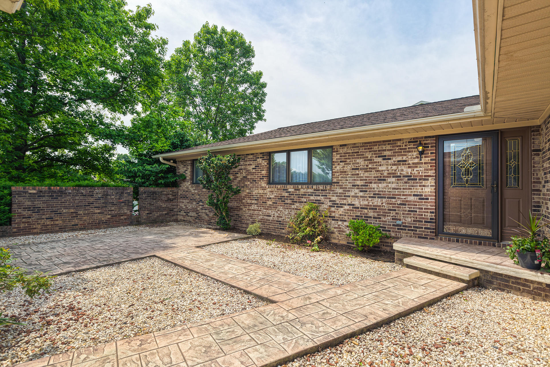 4925 Grape Tree Lane Roanoke, VA 24018 - Photo 3 of 27 a front view of a house with garden