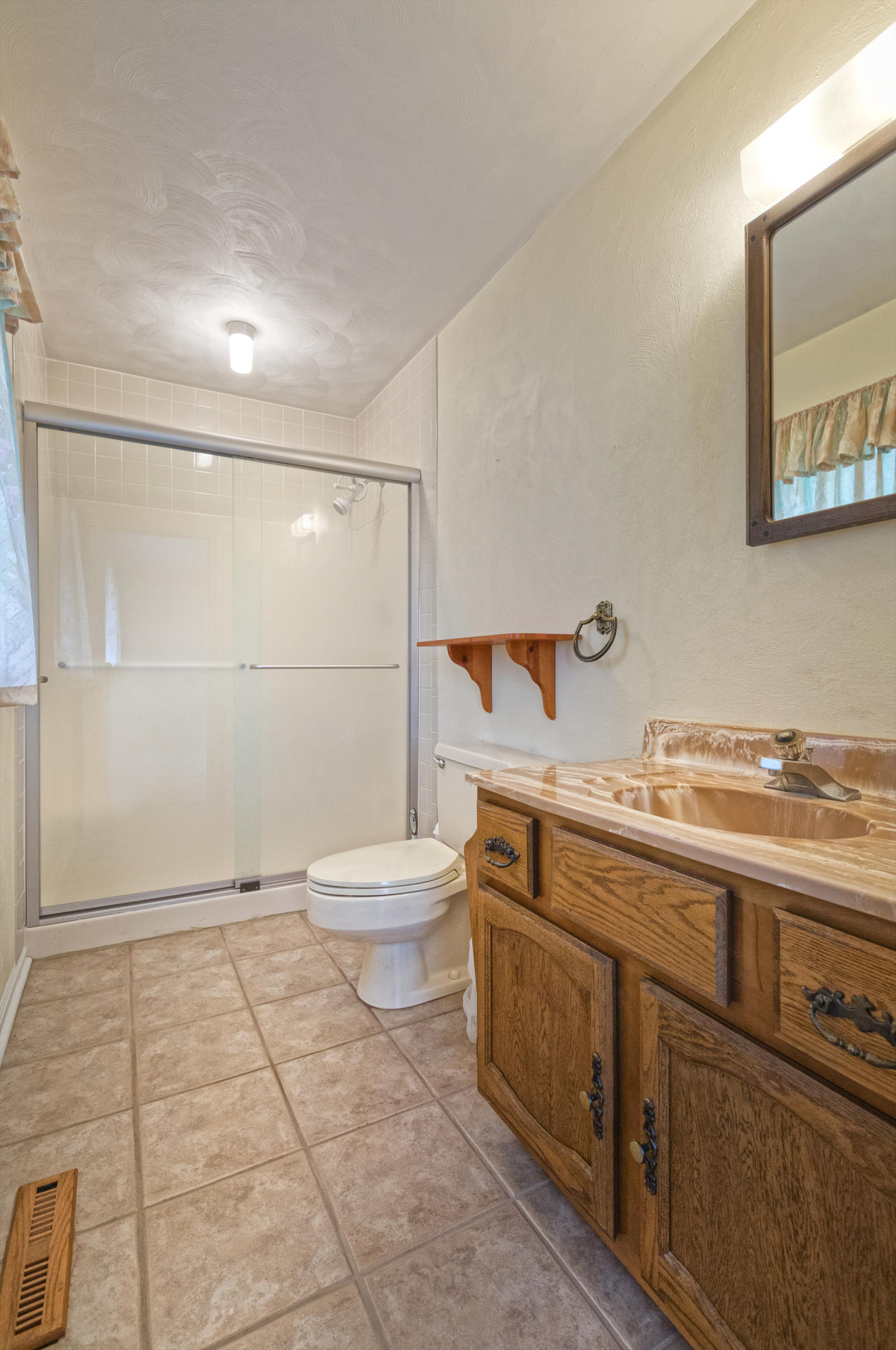 4925 Grape Tree Lane Roanoke, VA 24018 - Photo 21 of 27 a bathroom with a sink a toilet and shower