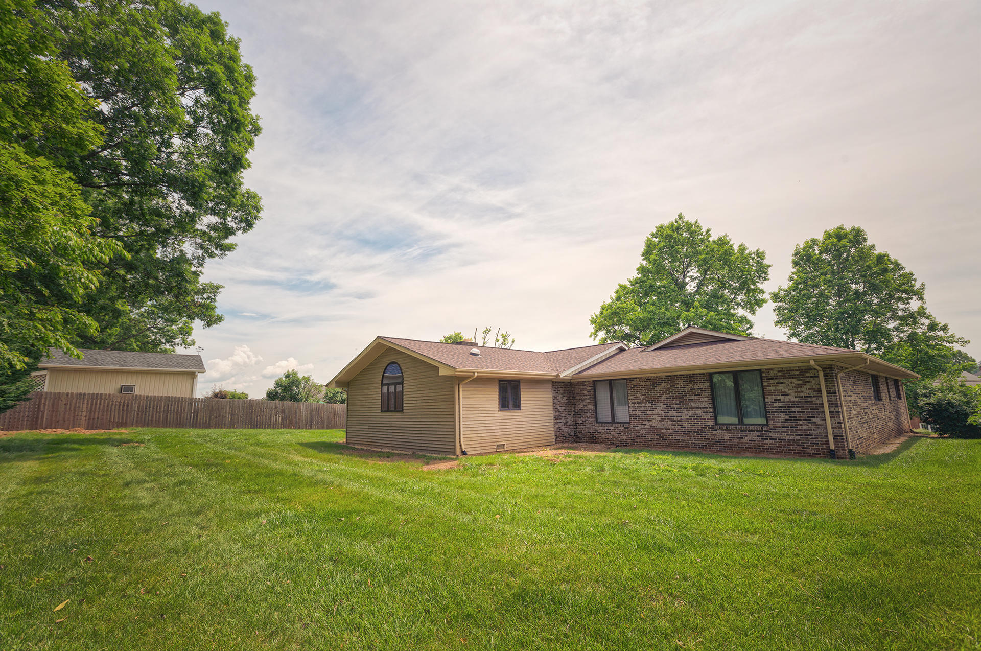 4925 Grape Tree Lane Roanoke, VA 24018 - Photo 26 of 27 a front view of a house with a garden