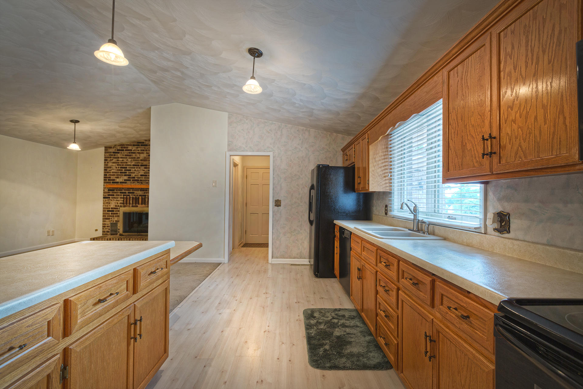 4925 Grape Tree Lane Roanoke, VA 24018 - Photo 5 of 27 a kitchen with granite countertop a sink stove and refrigerator