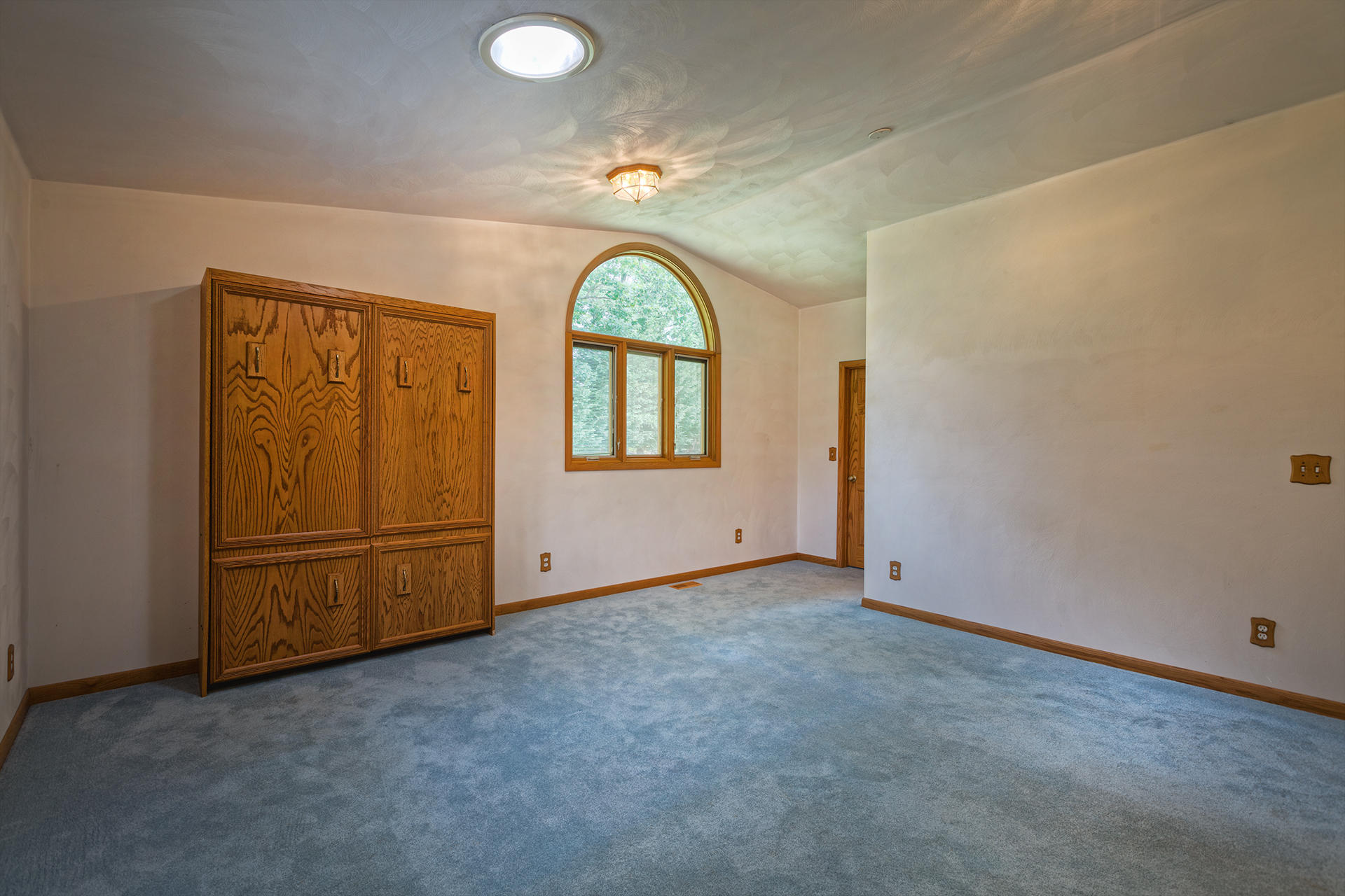 4925 Grape Tree Lane Roanoke, VA 24018 - Photo 9 of 27 an empty room with windows and exposed bricks