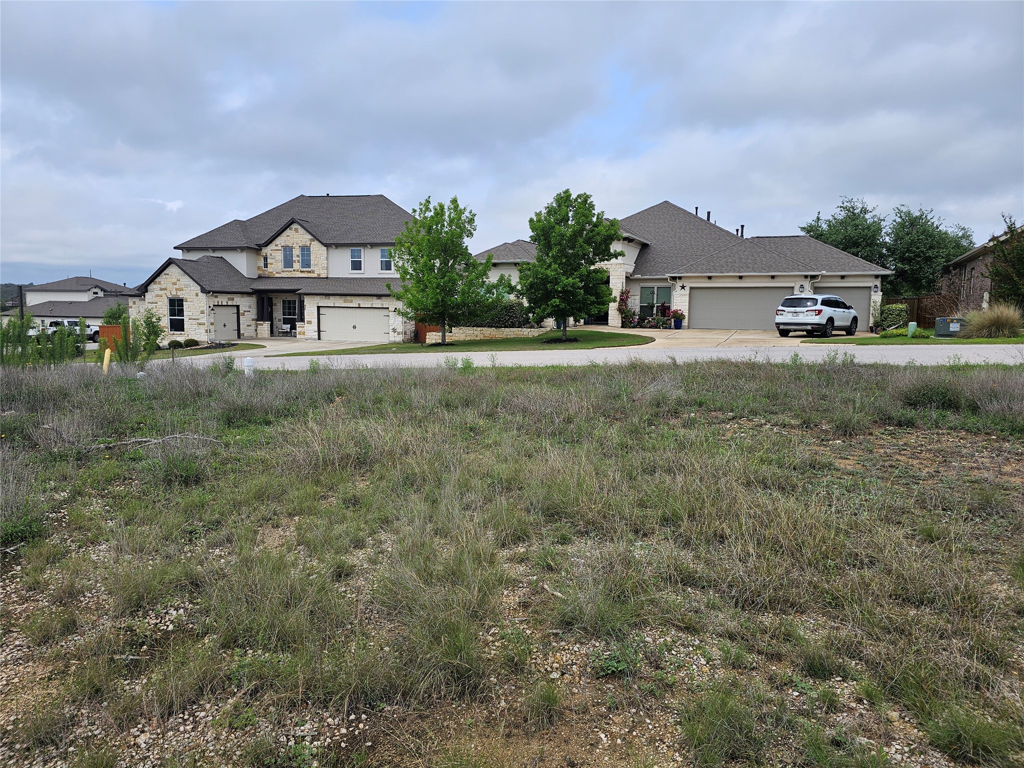 130 Capstone Court Dripping Springs, TX 78620 - Photo 5 of 10 a front view of a house with a yard