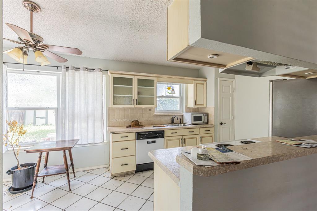 6504 Johnnie Street Watauga, TX 76148 - Photo 3 of 23 Kitchen featuring a peninsula with countertop, tile flooring, recessed lighting, and a ceiling fan