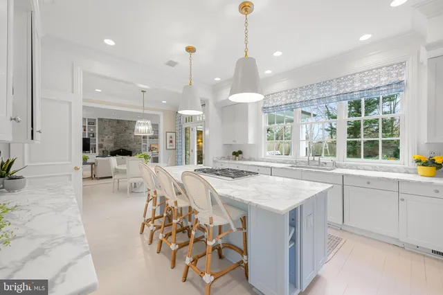 a kitchen with stainless steel appliances granite countertop a stove and more cabinets