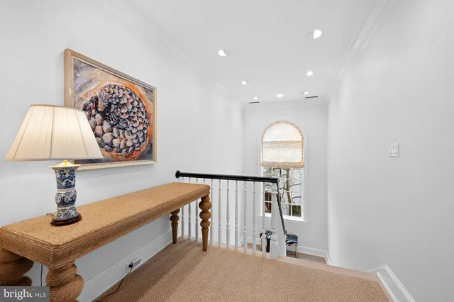 a view of a hallway view with staircase