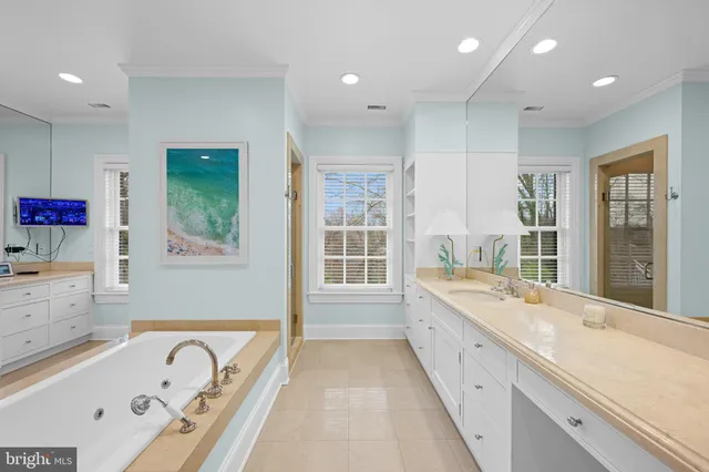 a bathroom with a toilet sink shower and mirror