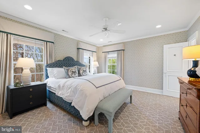 a spacious bedroom with a bed and a couch