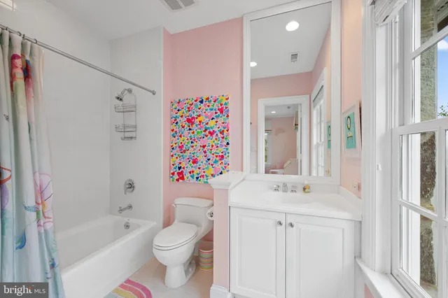 a living room with furniture and a stairs