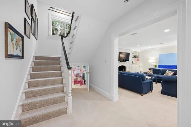 a view of a house with swimming pool and sitting area