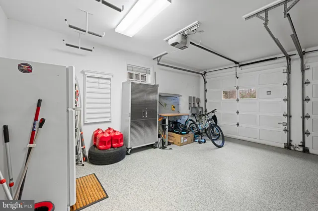a view of a patio with a table chairs and a backyard