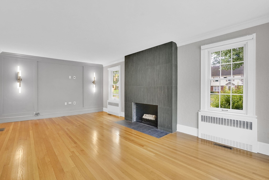 70 Dover Road Longmeadow, MA 01106 - Photo 35 of 37 a view of empty room with wooden floor and fireplace
