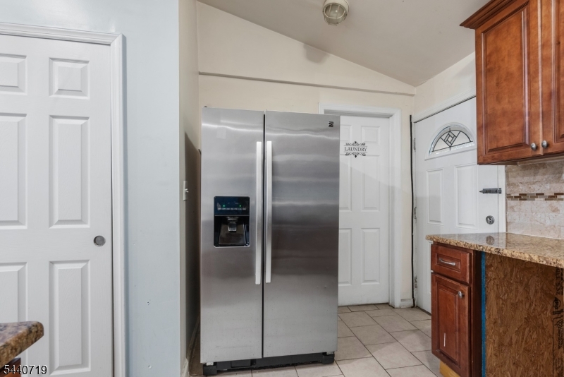 136 Smith Street Elizabeth, NJ 07201 - Photo 11 of 38 a kitchen with stainless steel appliances granite countertop a refrigerator and a sink