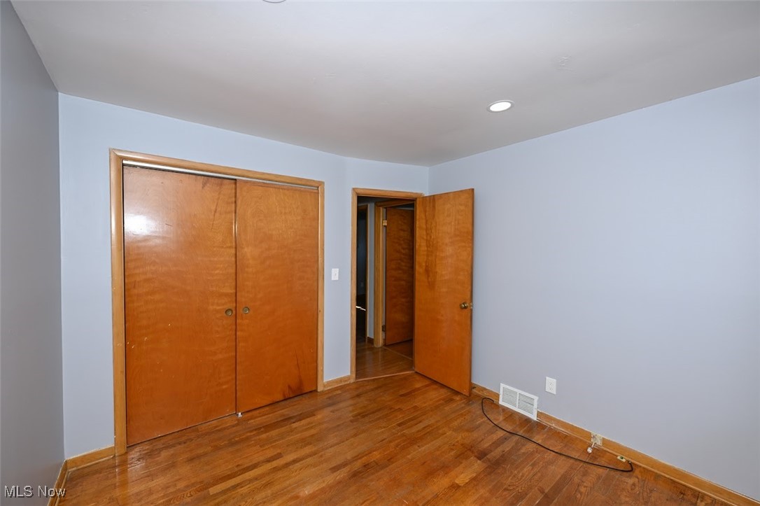 13150 Sprague Road Cleveland, OH 44130 - Photo 26 of 39 Unfurnished bedroom with wood finished floors, a closet, and recessed lighting