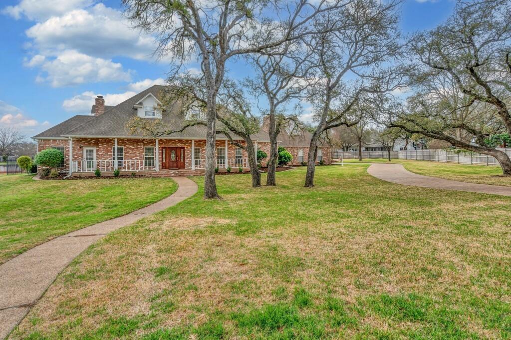 3111 Rockbridge Road Waco, TX 76657 - Photo 2 of 40 a view of a house with a yard and sitting area
