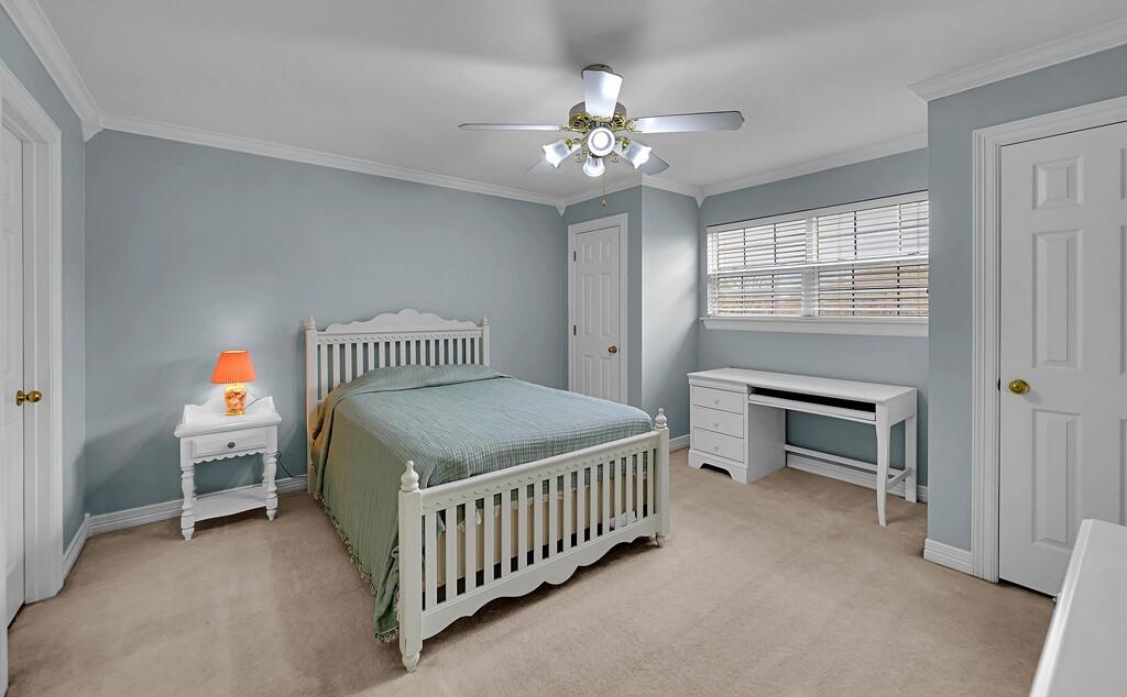 3111 Rockbridge Road Waco, TX 76657 - Photo 23 of 40 a bedroom with a bed and a chandelier