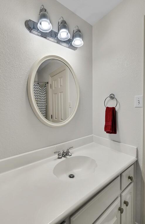 3111 Rockbridge Road Waco, TX 76657 - Photo 24 of 40 a bathroom with a sink and a mirror
