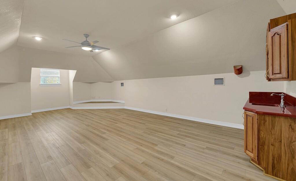 3111 Rockbridge Road Waco, TX 76657 - Photo 26 of 40 an empty room with wooden floor and windows