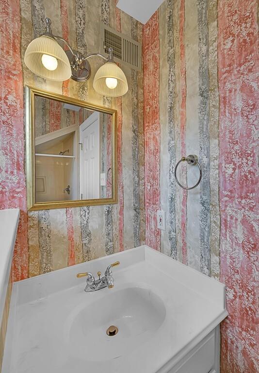 3111 Rockbridge Road Waco, TX 76657 - Photo 27 of 40 a bathroom with a sink and a mirror