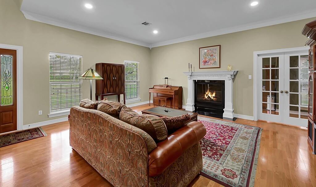 3111 Rockbridge Road Waco, TX 76657 - Photo 4 of 40 a living room with furniture and a fireplace