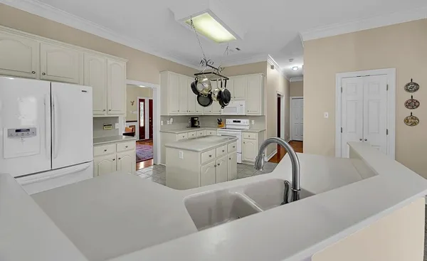 a kitchen with a sink and cabinets