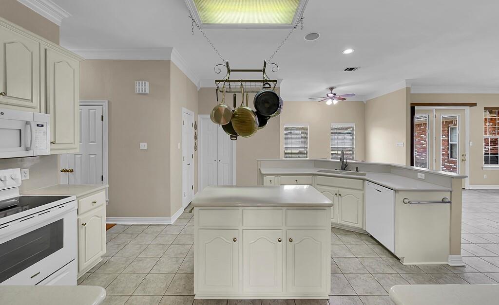 3111 Rockbridge Road Waco, TX 76657 - Photo 8 of 40 a kitchen with a sink and cabinets