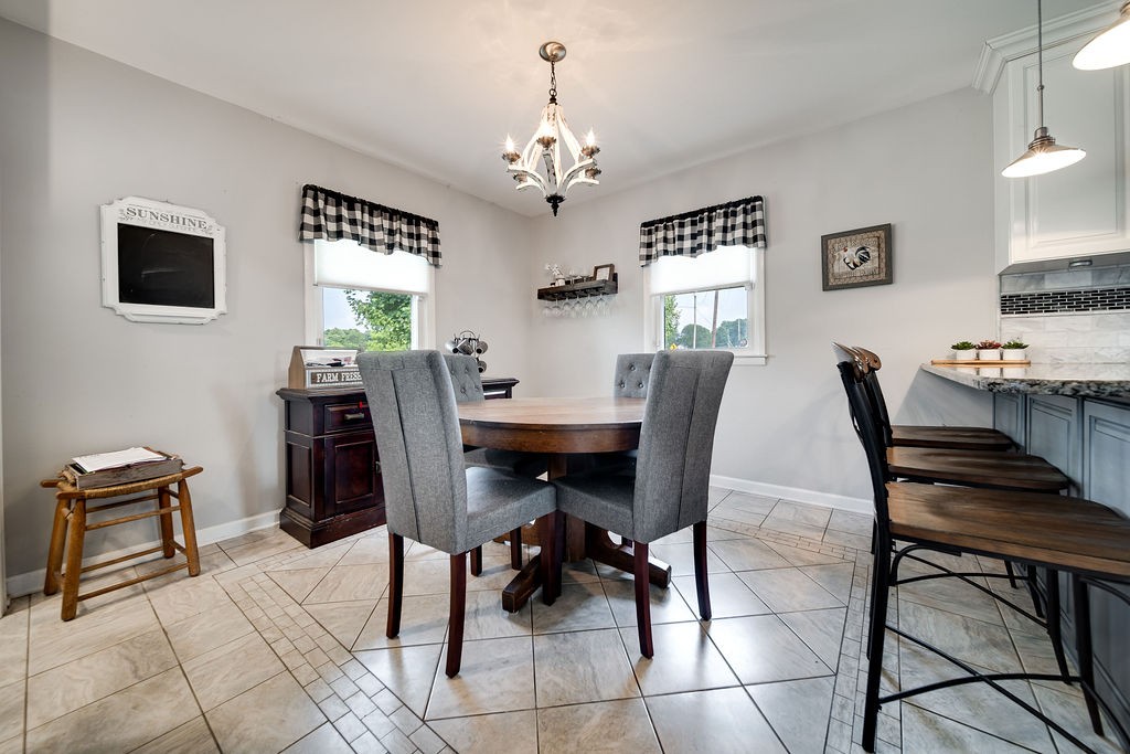 6634 Flewellyn Road Springfield, TN 37172 - Photo 25 of 49 a view of a dining room with furniture and window