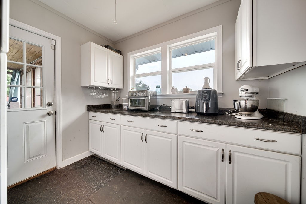 6634 Flewellyn Road Springfield, TN 37172 - Photo 29 of 49 a kitchen with stainless steel appliances white cabinets and a window