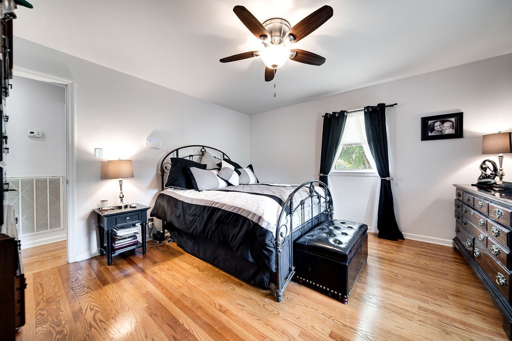 6634 Flewellyn Road Springfield, TN 37172 - Photo 34 of 49 a bedroom with a bed and wooden floor