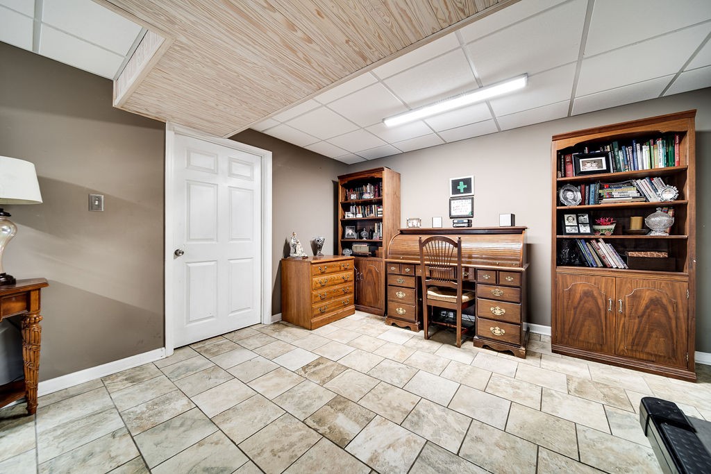 6634 Flewellyn Road Springfield, TN 37172 - Photo 39 of 49 a bedroom with furniture window and book shelf