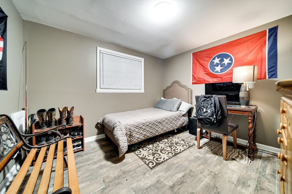 6634 Flewellyn Road Springfield, TN 37172 - Photo 41 of 49 a bedroom with furniture and a bed