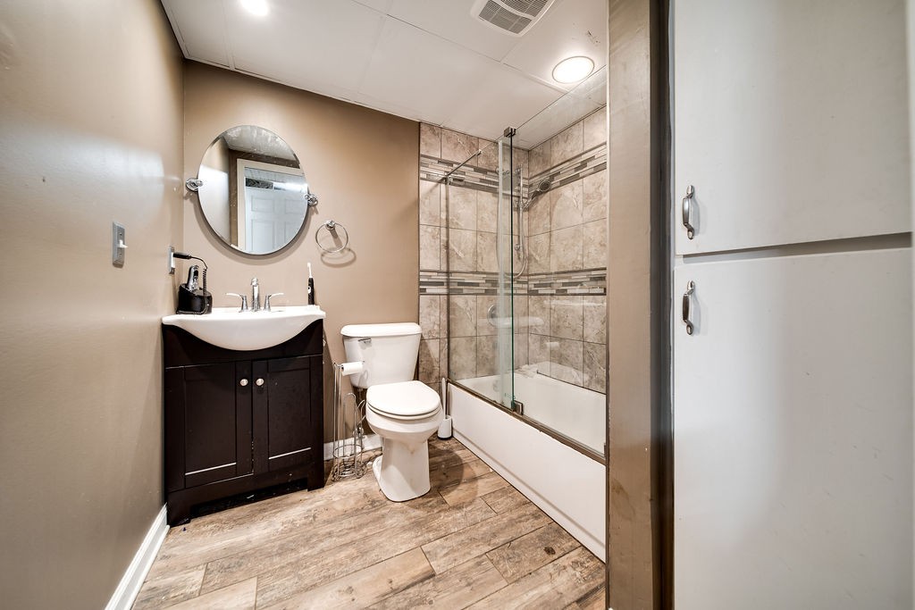 6634 Flewellyn Road Springfield, TN 37172 - Photo 43 of 49 a bathroom with a toilet a sink and a mirror
