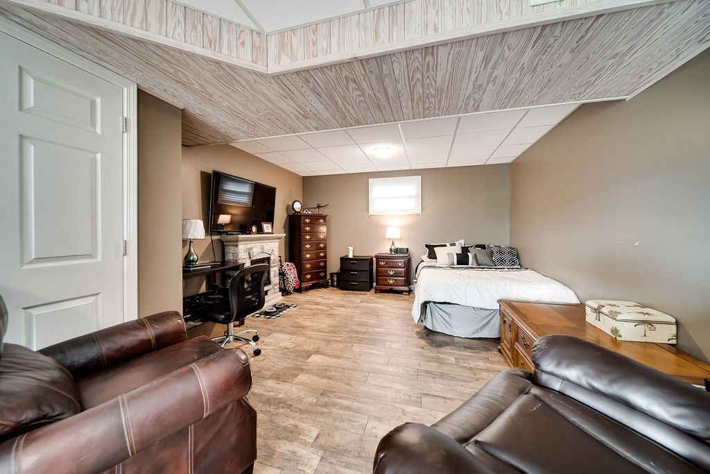 6634 Flewellyn Road Springfield, TN 37172 - Photo 46 of 49 a living room with furniture and a flat screen tv