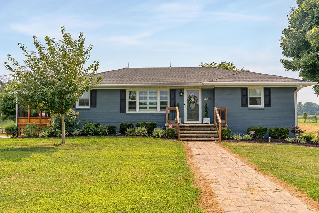 6634 Flewellyn Road Springfield, TN 37172 - Photo 9 of 49 a front view of a house with a yard